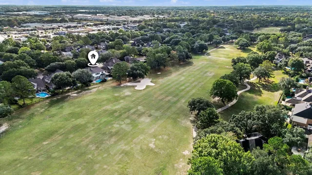 an aerial view of house with yard