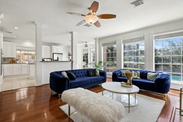 a living room with furniture fireplace and flat screen tv