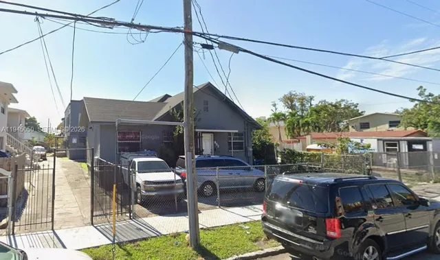 a car parked in front of a house