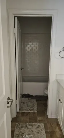 a bathroom with a glass door shower