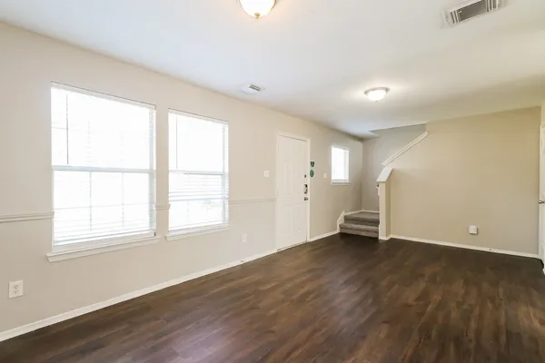 a view of a kitchen with a sink and a refrigerator