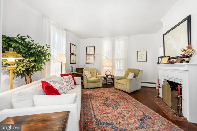 a living room with furniture and a chair