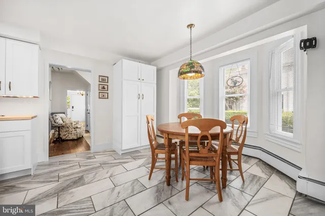 a kitchen with stainless steel appliances kitchen island granite countertop a sink and cabinets