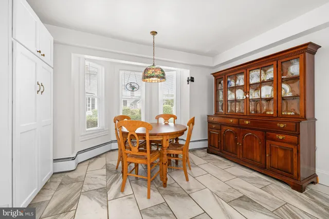 a kitchen with cabinets and window