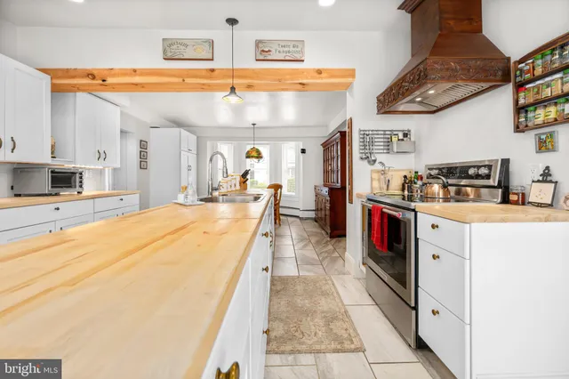 a bedroom with furniture and a wooden floor