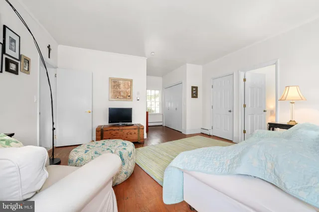 a bathroom with a toilet a sink and a mirror