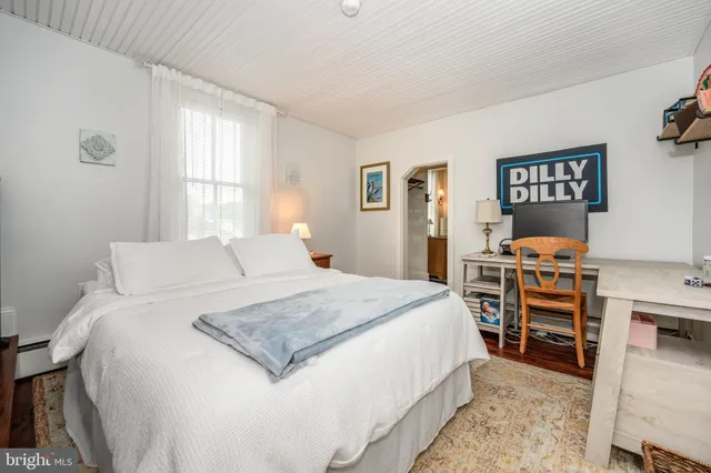 a room with wooden floor and stairs