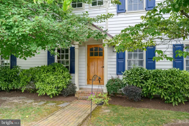 a bathroom with a sink a mirror and a shower