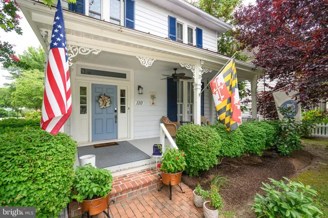 a living room with furniture fireplace and window
