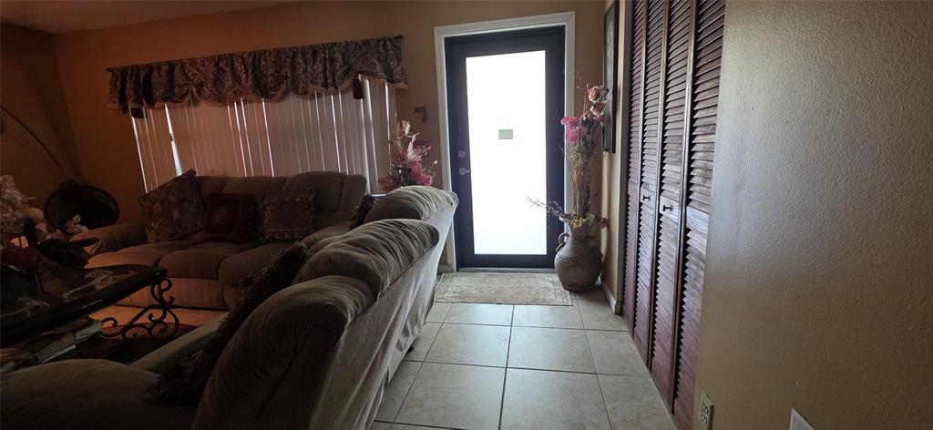 9522 Affirmed Lane Boca Raton, FL 33496 - Photo 2 of 10 a living room with furniture and a window