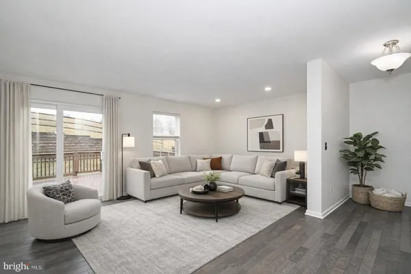 a view of a kitchen with wooden floor