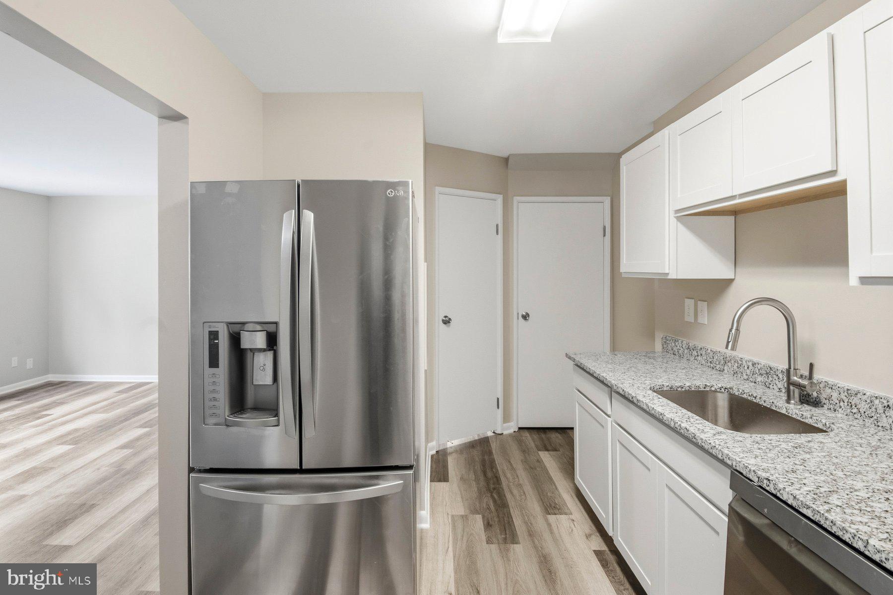 9080 Moonshine Hollow, Unit F Laurel, MD 20723 - Photo 7 of 24 Modern kitchen with sleek finishes.