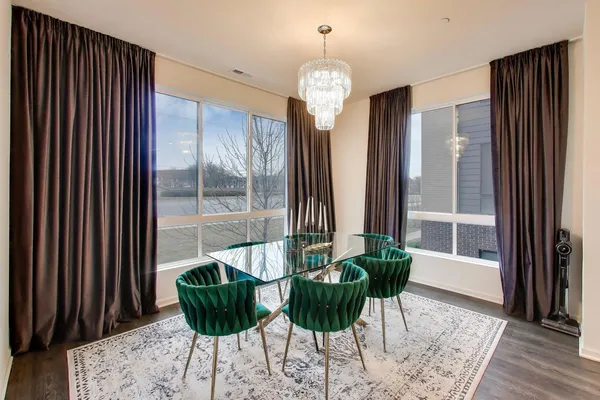 a view of a dining room with furniture and window