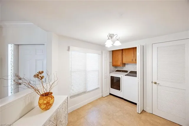 a view of a kitchen with a sink dishwasher and a refrigerator