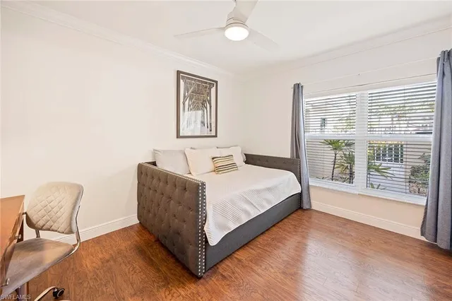 a bedroom with a bed and a chair