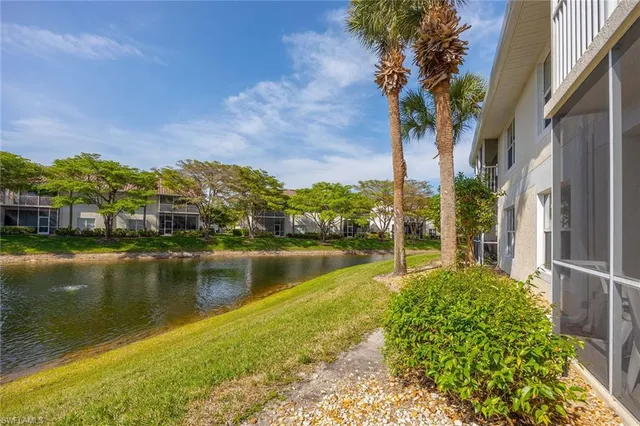 a view of a lake with a house in the background