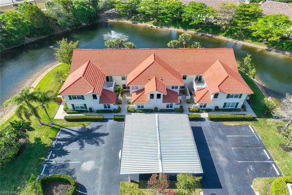 an aerial view of house with yard swimming pool and outdoor seating