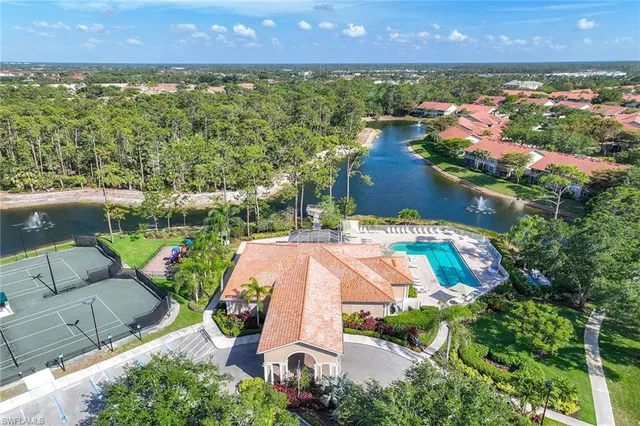 an aerial view of residential houses with outdoor space and street view