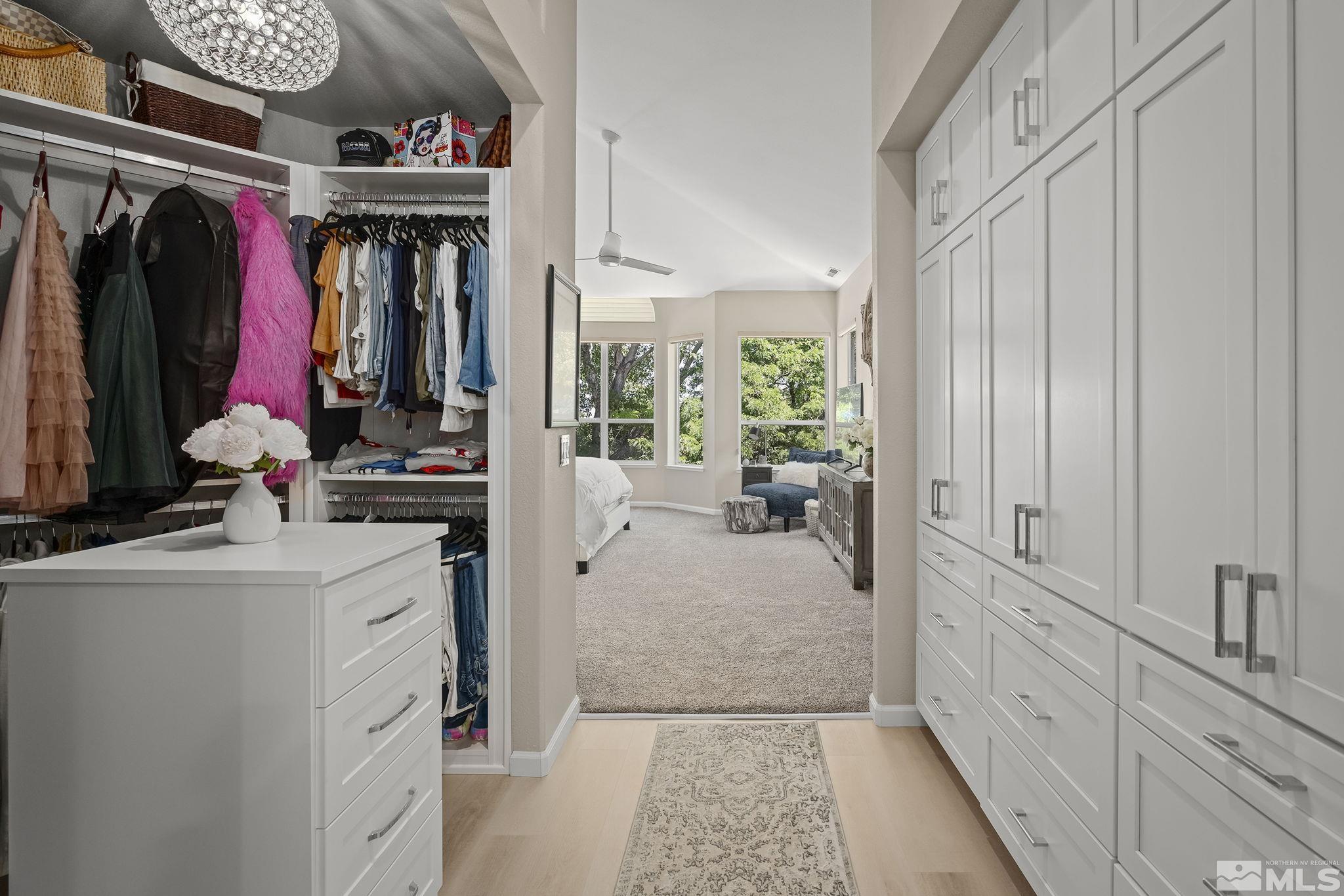 6156 Wycliffe Circle Reno, NV 89519 - Photo 13 of 30 a view of walk in closet with clothes and shoes