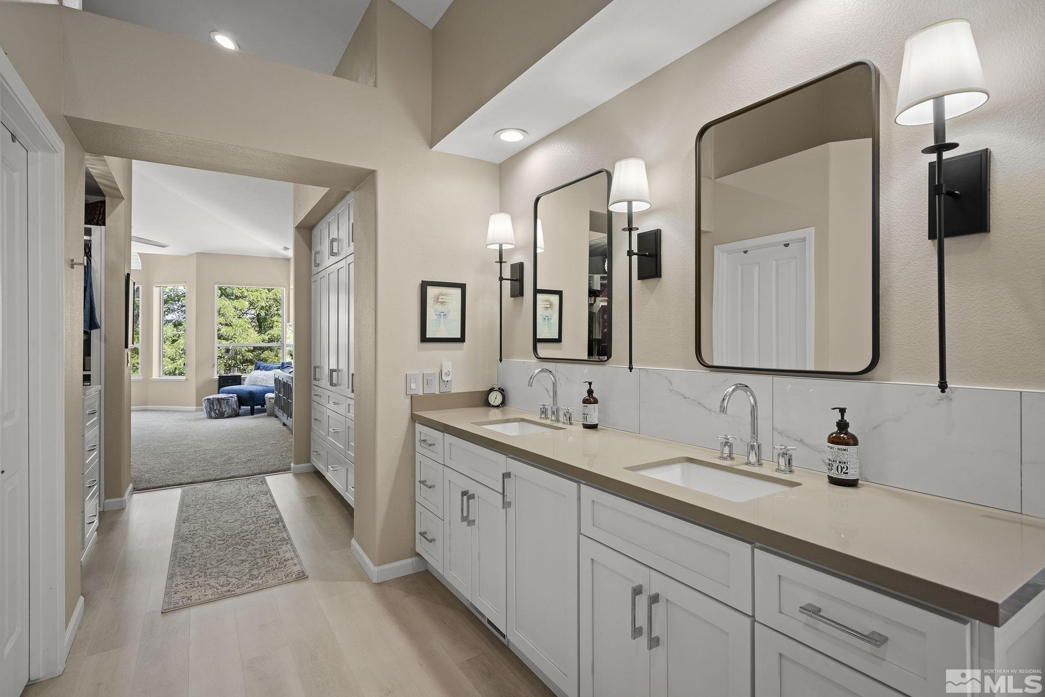 6156 Wycliffe Circle Reno, NV 89519 - Photo 15 of 30 a en suite bathroom with double sink and a mirror