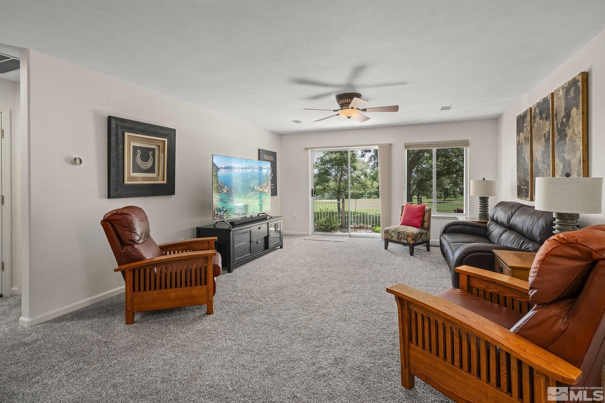 6156 Wycliffe Circle Reno, NV 89519 - Photo 18 of 30 a living room with furniture and a large window