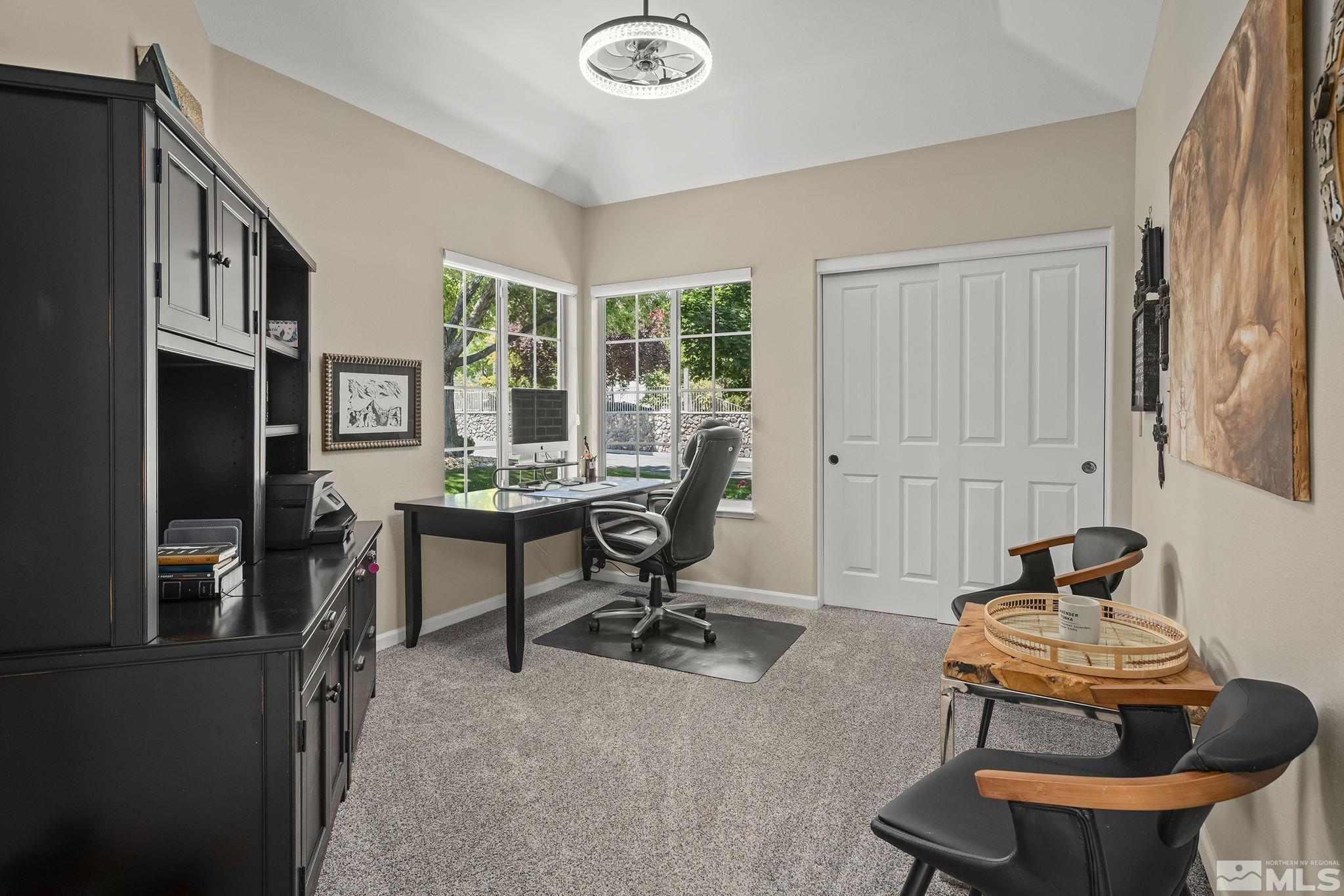6156 Wycliffe Circle Reno, NV 89519 - Photo 22 of 30 a view of a workspace with furniture and a window