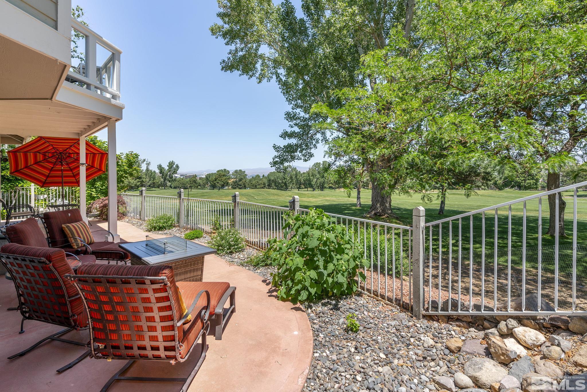 6156 Wycliffe Circle Reno, NV 89519 - Photo 24 of 30 a patio with water view fountain and a yard