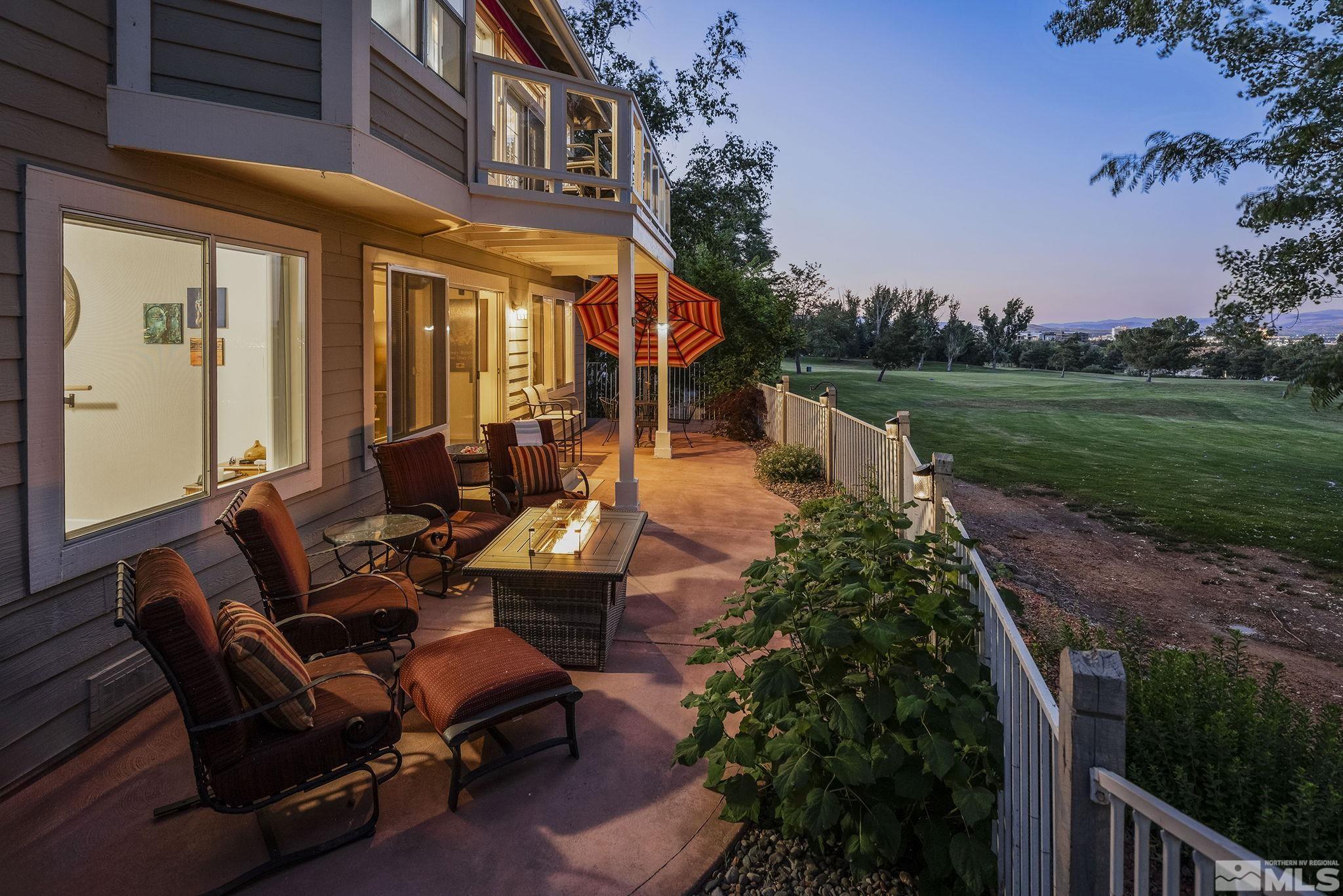 6156 Wycliffe Circle Reno, NV 89519 - Photo 28 of 30 a view of a patio with table and chairs potted plants and large tree