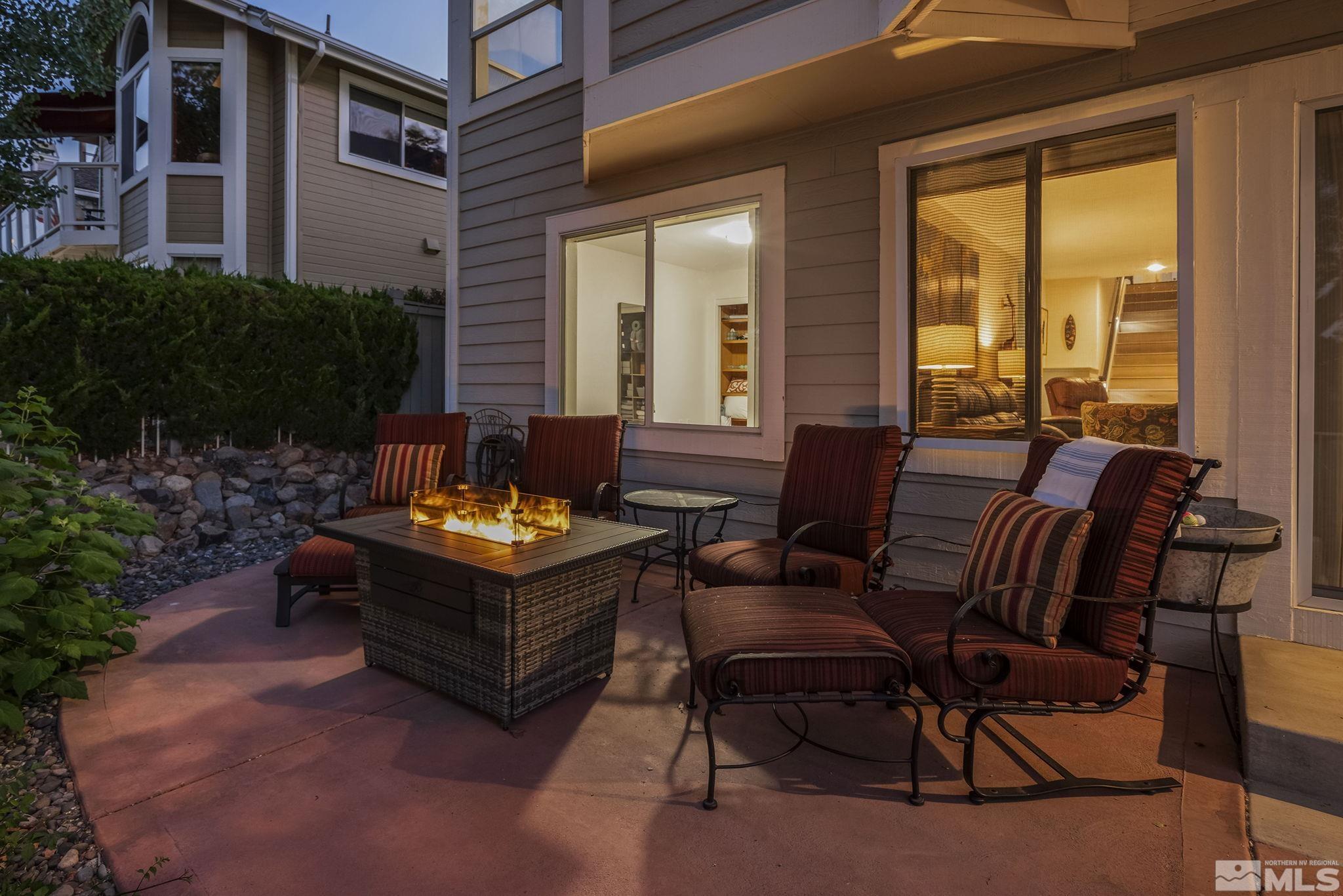 6156 Wycliffe Circle Reno, NV 89519 - Photo 29 of 30 a view of a patio with couches table and chairs and potted plants