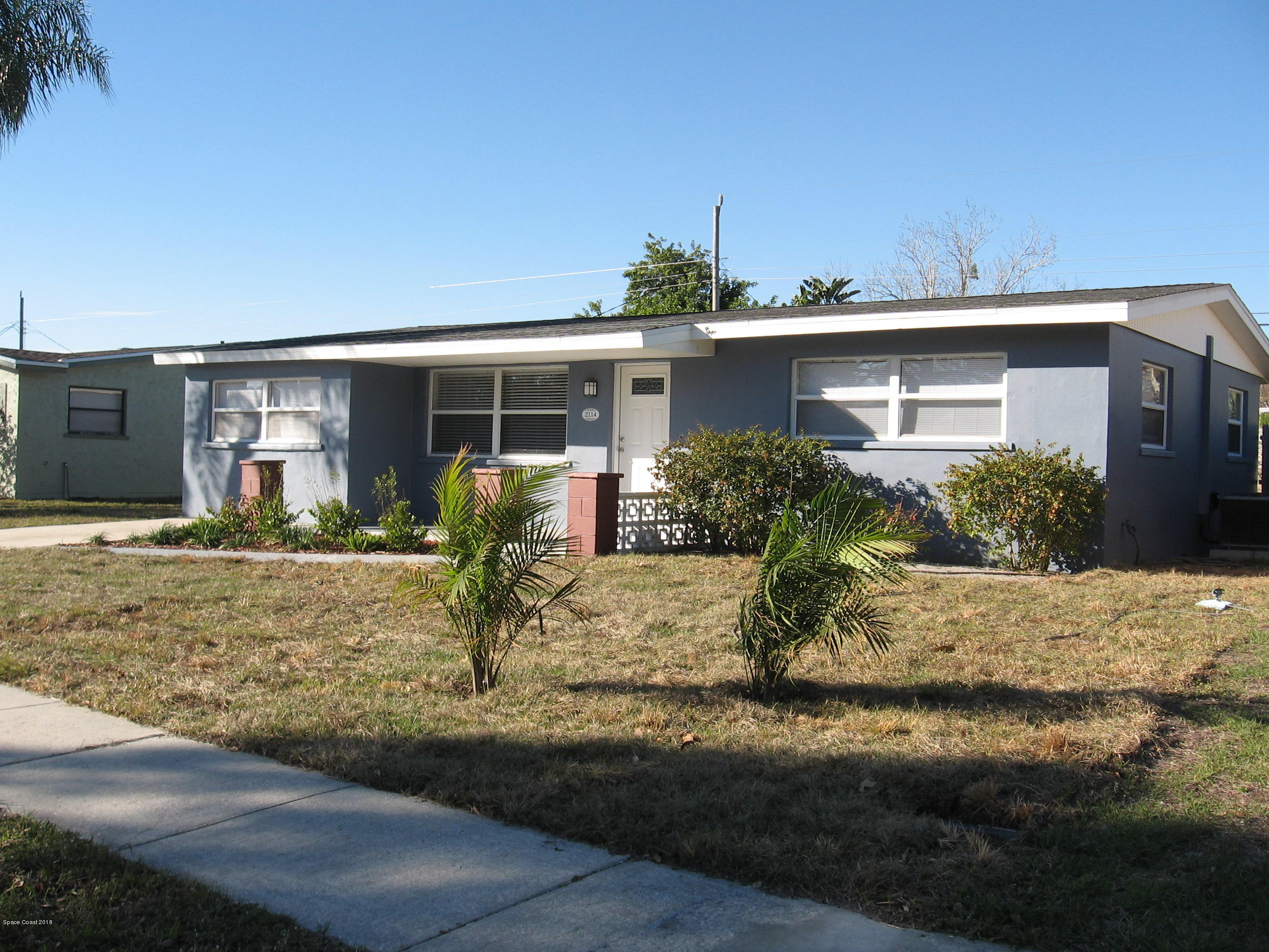2114 Woodbury Road Melbourne, FL 32935 - Photo 1 of 31 FRONT