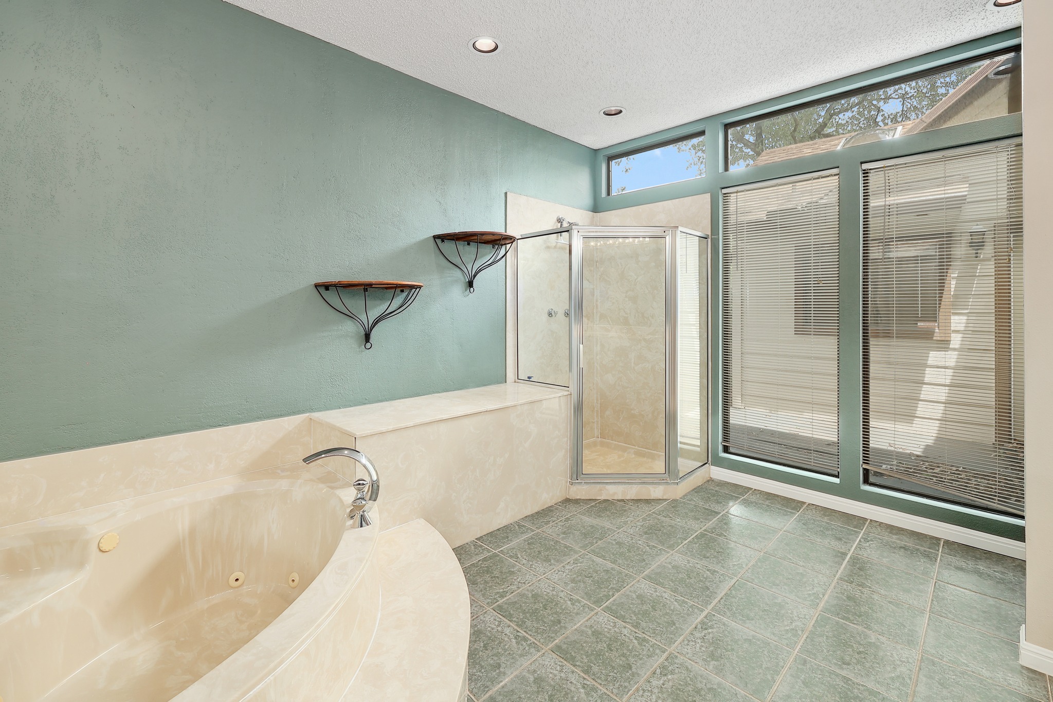 2202 Warfield Way Austin, TX 78728 - Photo 18 of 32 Indulge in a primary bathroom oasis featuring a deep soaking tub and a separate glass-enclosed shower.