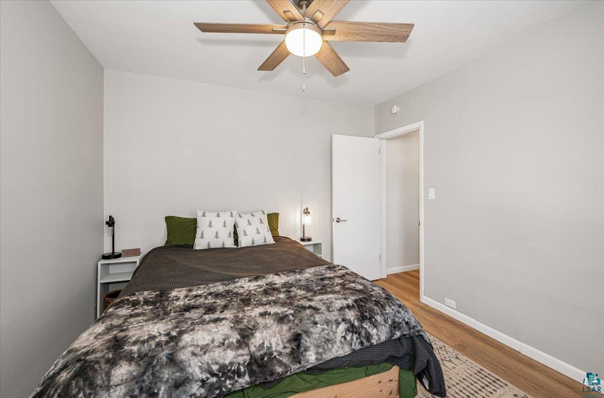 415 14th Street Cloquet, MN 55720 - Photo 7 of 20 Bedroom with light wood-type flooring and a ceiling fan
