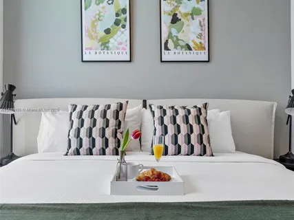 a white couch sitting next to a white wall