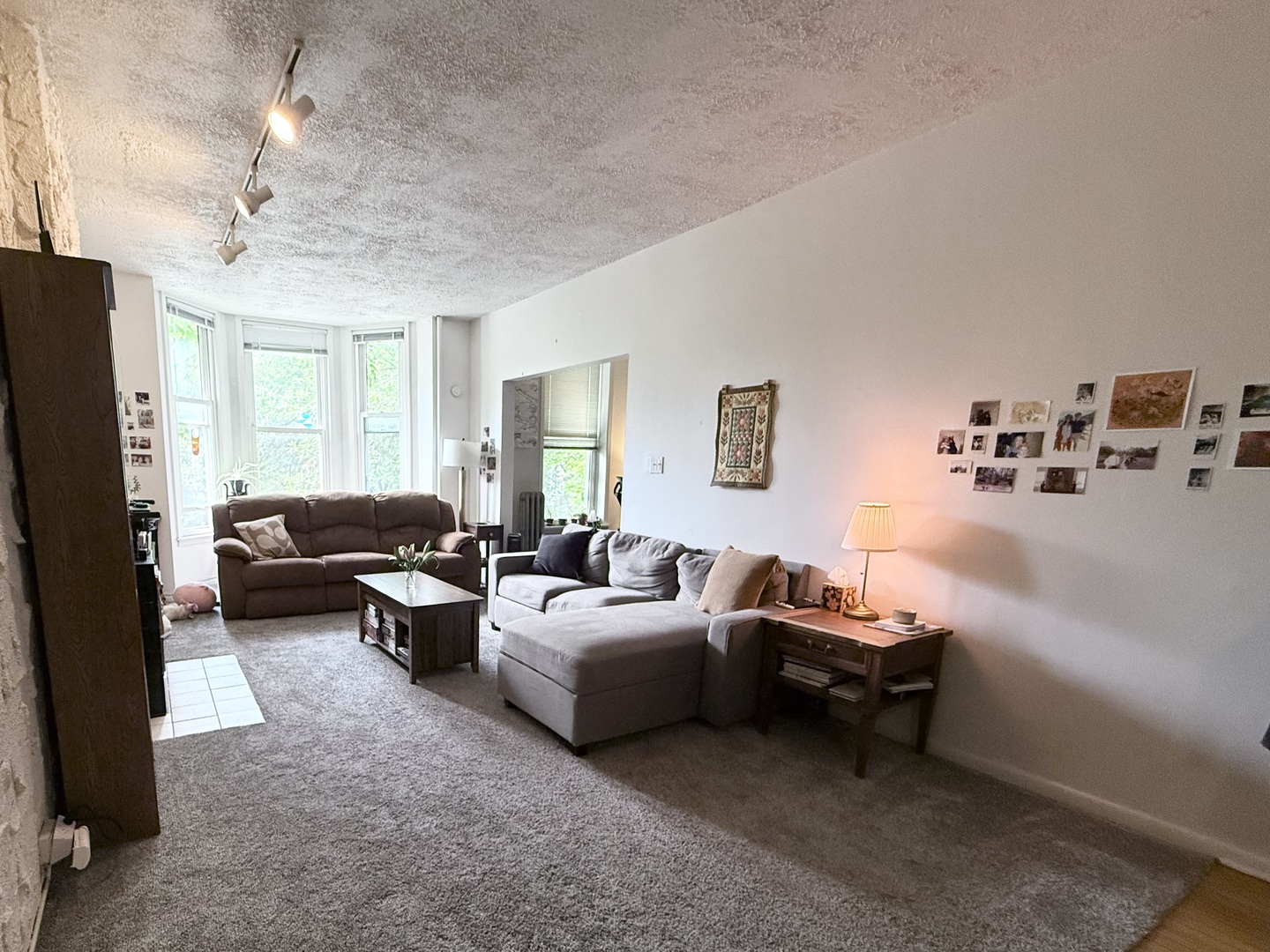 1132 West Addison Street, Unit 2 Chicago, IL 60613 - Photo 2 of 11 a living room with furniture and a chandelier