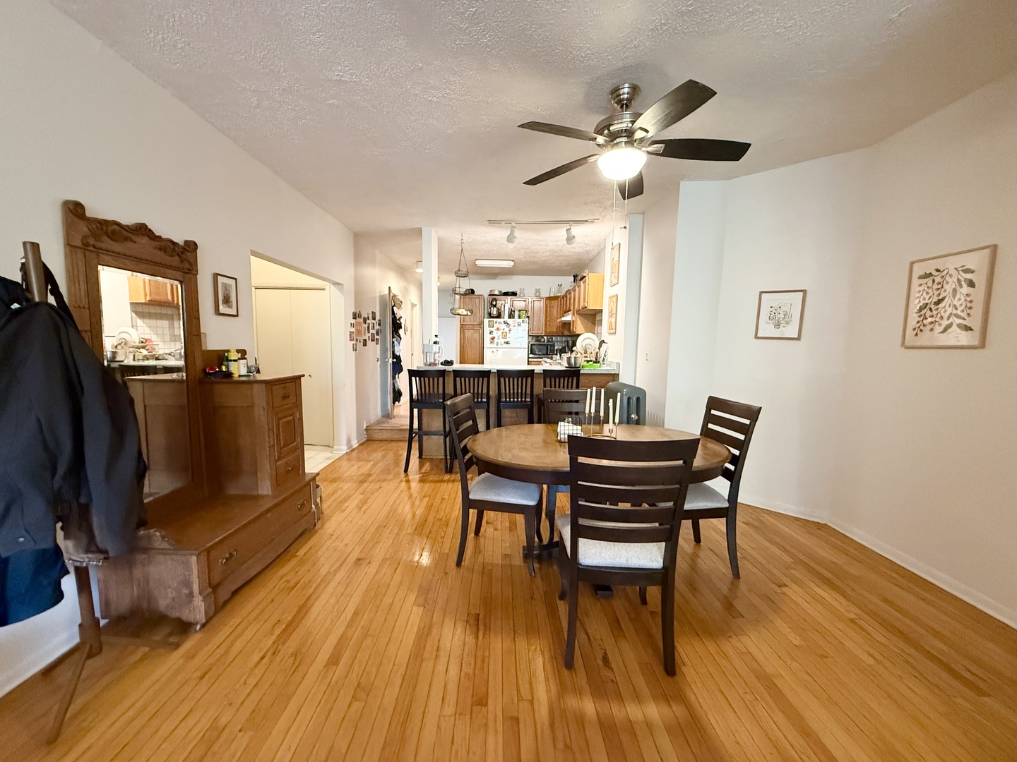 1132 West Addison Street, Unit 2 Chicago, IL 60613 - Photo 6 of 11 a view of a dining room with furniture and wooden floor
