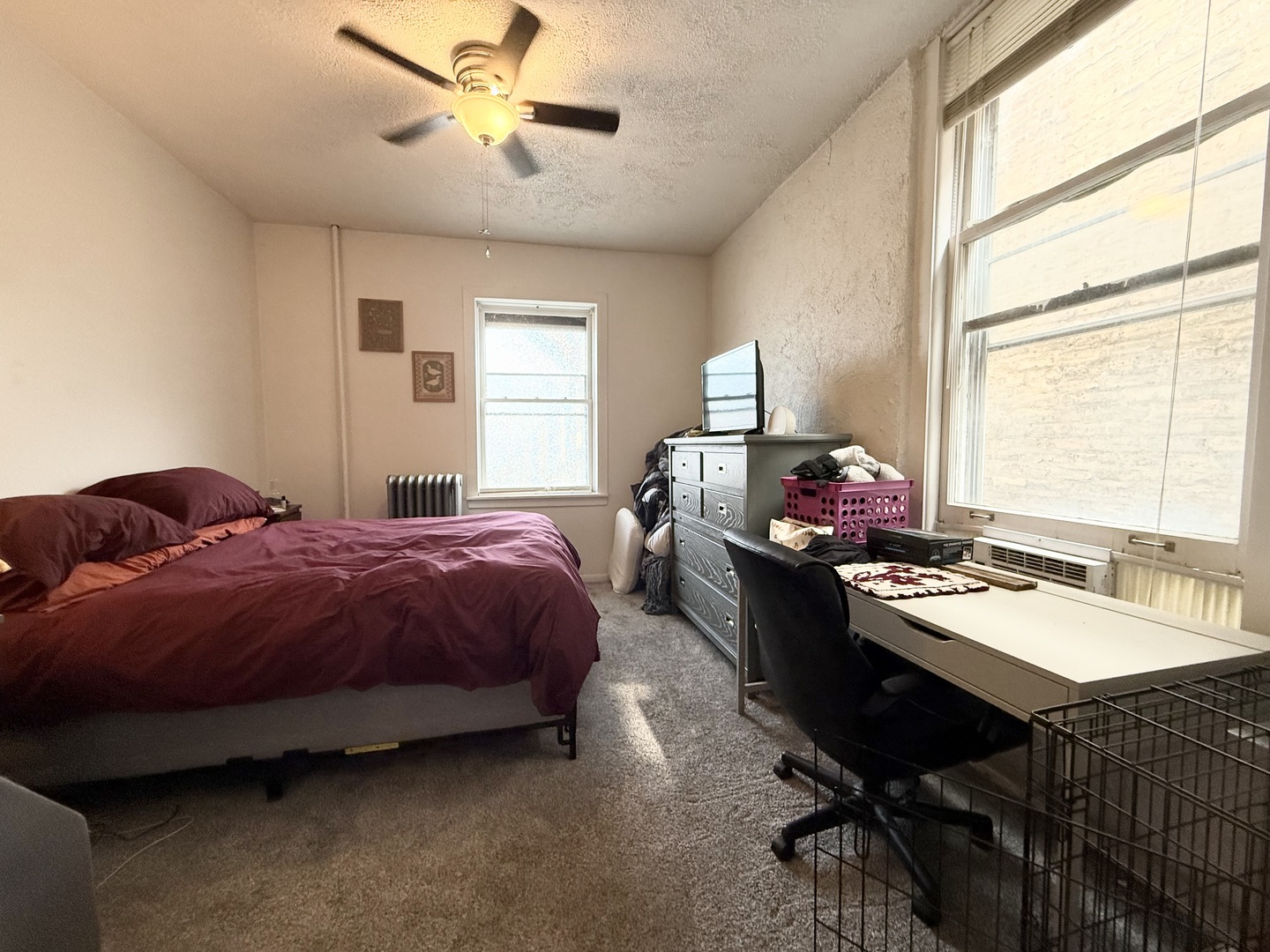 1132 West Addison Street, Unit 2 Chicago, IL 60613 - Photo 10 of 11 a bed room with a bed window and a desk