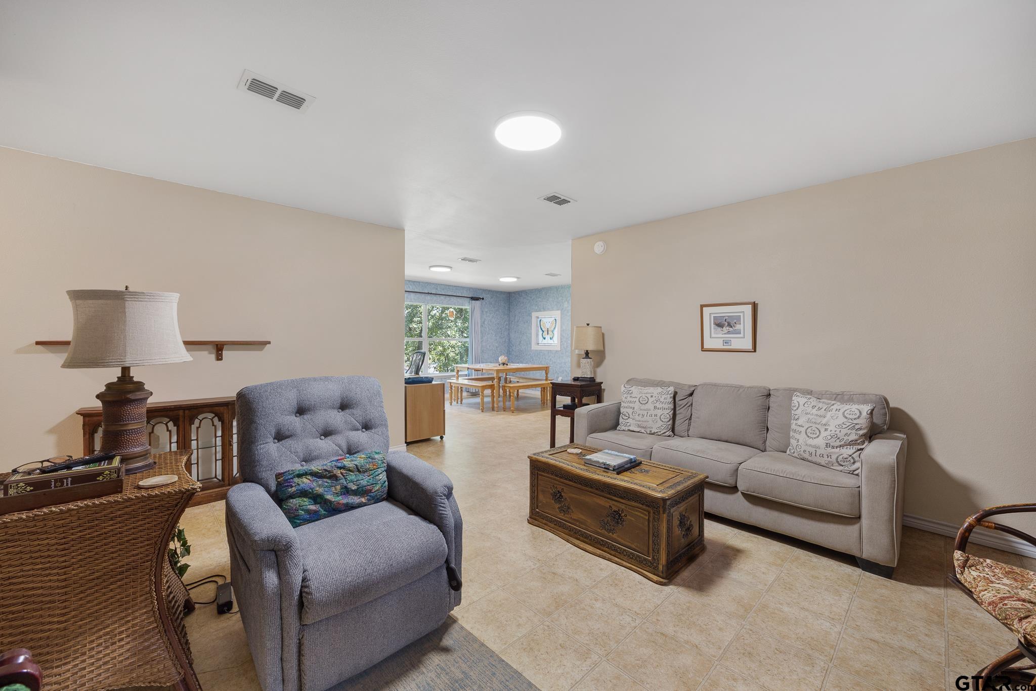 20650 West Grove Club Lake Road Whitehouse, TX 75791 - Photo 18 of 39 a living room with furniture and a couch