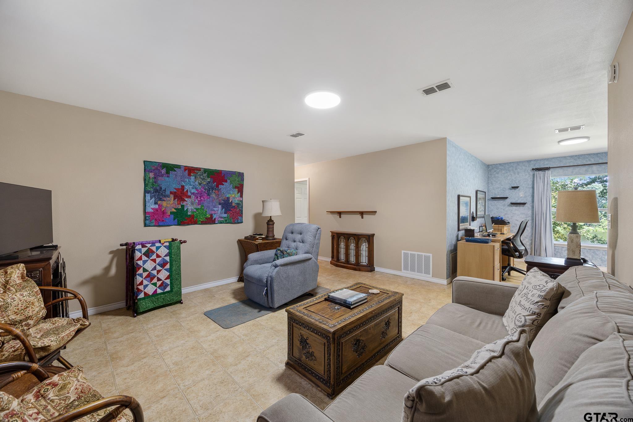 20650 West Grove Club Lake Road Whitehouse, TX 75791 - Photo 19 of 39 a living room with furniture and a flat screen tv