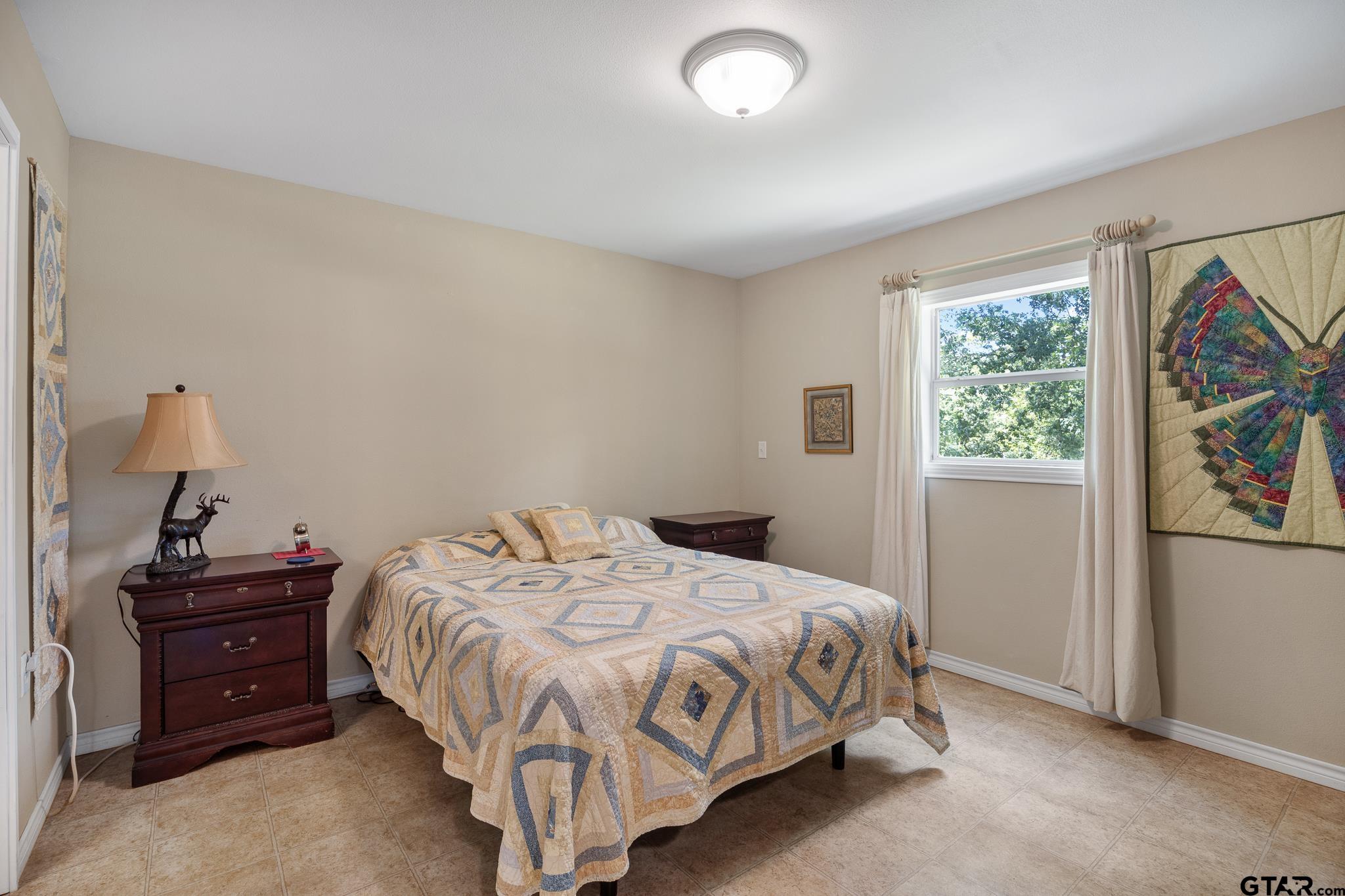 20650 West Grove Club Lake Road Whitehouse, TX 75791 - Photo 20 of 39 a bedroom with a bed and a window