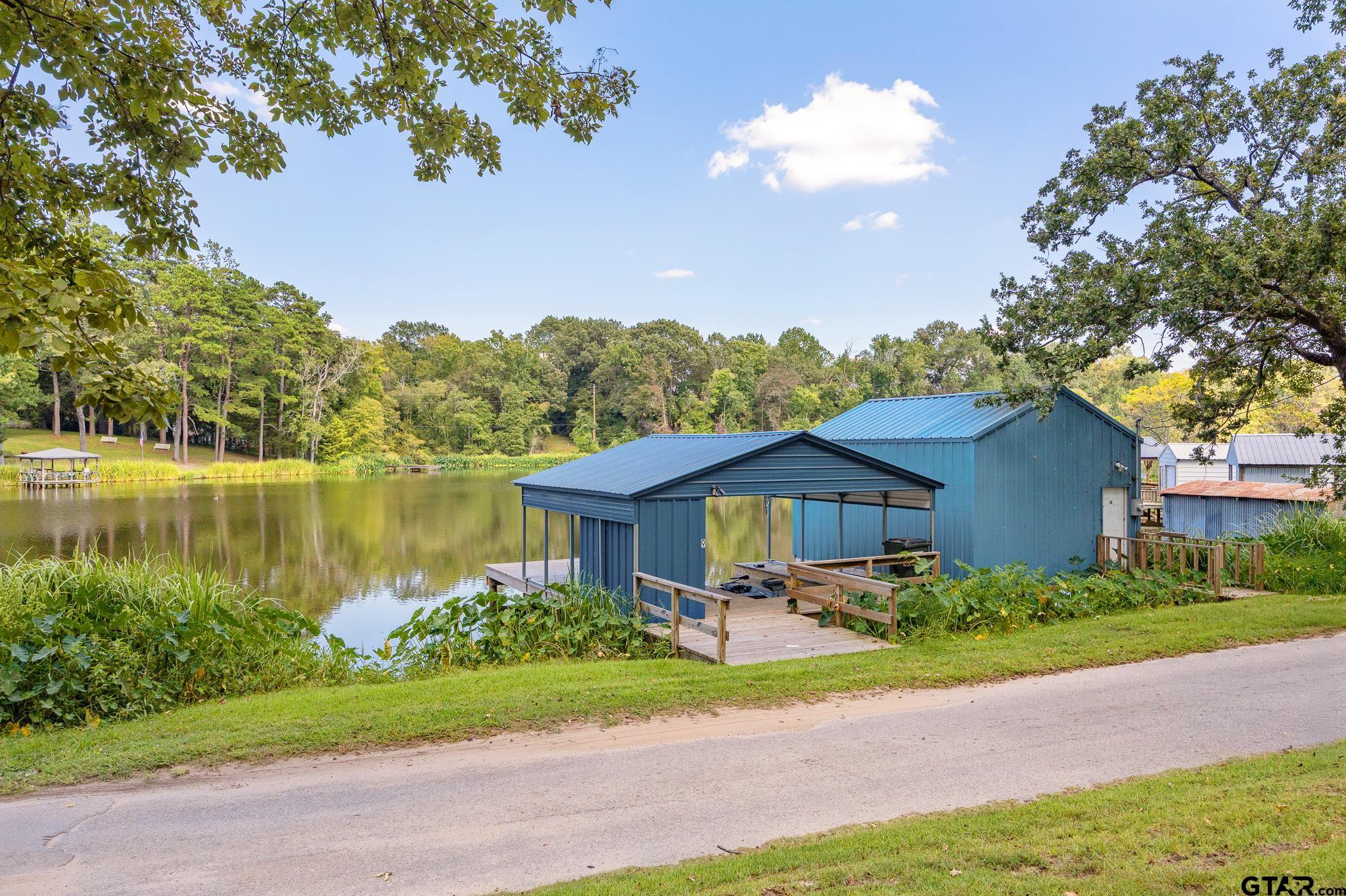20650 West Grove Club Lake Road Whitehouse, TX 75791 - Photo 28 of 39 a front view of a house with a yard and large trees