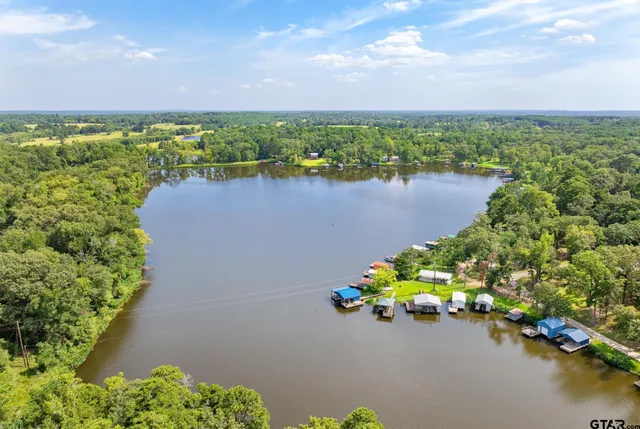 a view of a lake with a yard