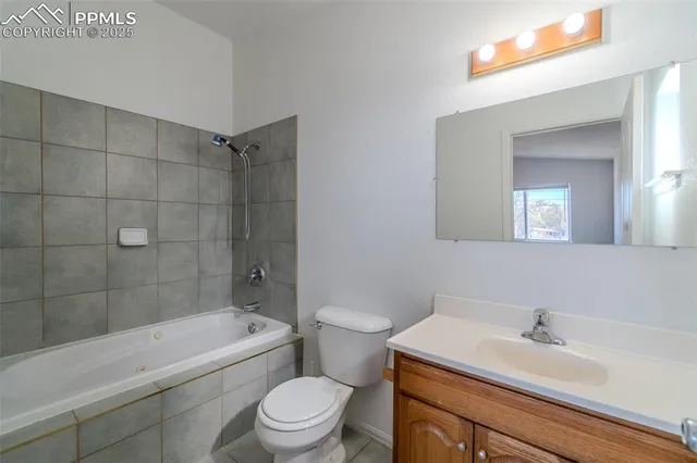 a bathroom with a sink mirror toilet and bathtub