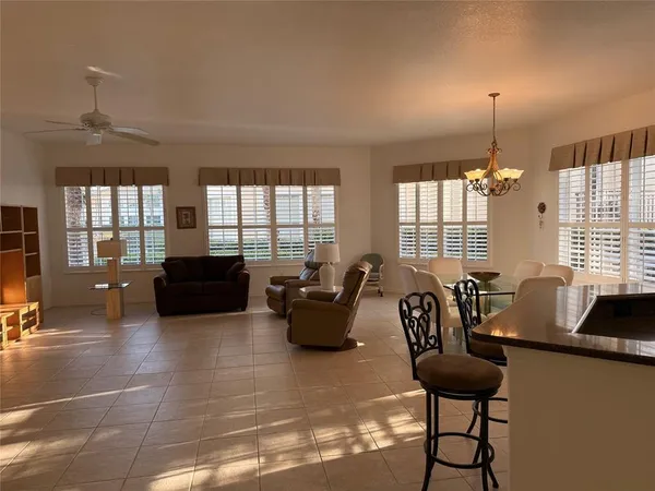 a kitchen with a sink a counter top space cabinets and stainless steel appliances