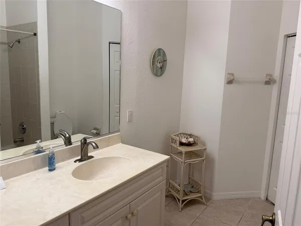 a white bath tub sitting next to a toilet