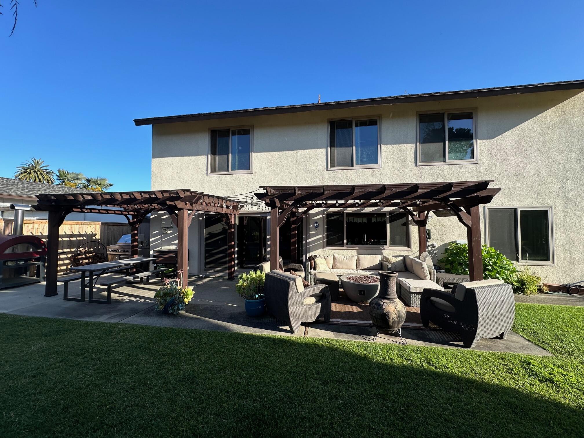 7166 Armstrong Road Goleta, CA 93117 - Photo 14 of 17 a backyard of a house with table and chairs