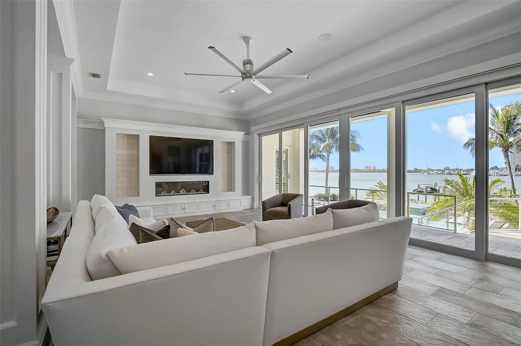 101 Seagull Lane Sarasota, FL 34236 - Photo 14 of 90 a living room with furniture and a flat screen tv