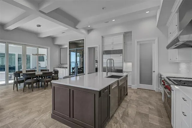 a room with furniture pool table and flat screen tv