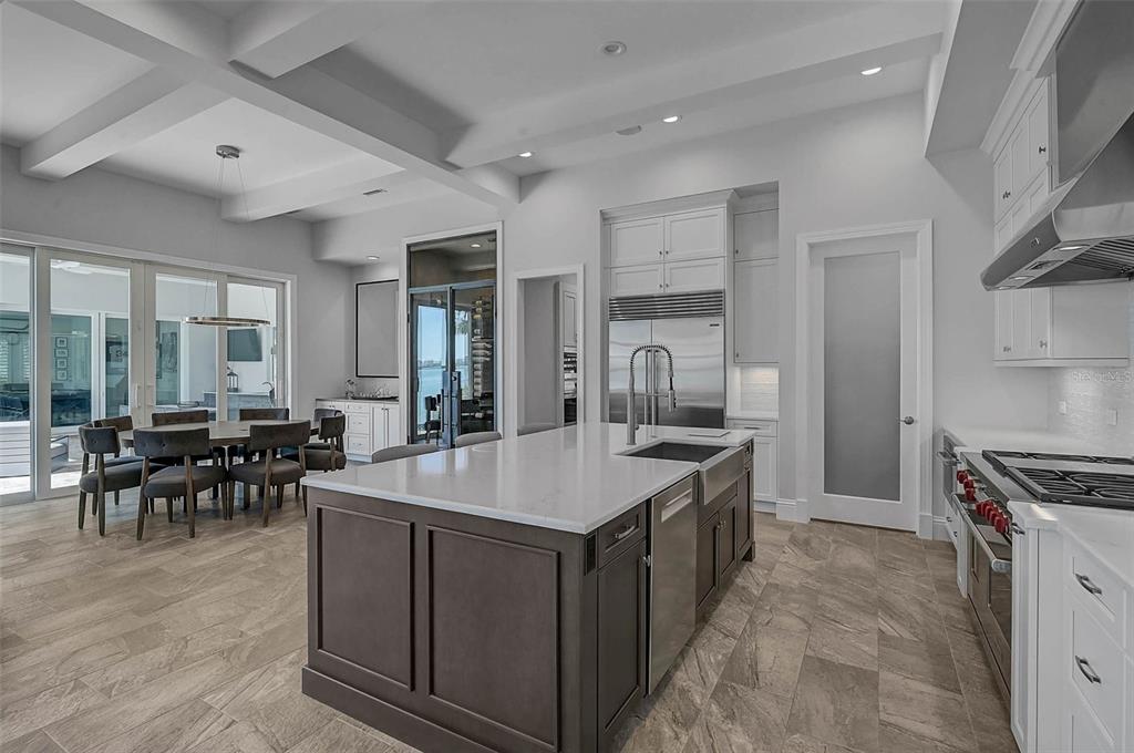 101 Seagull Lane Sarasota, FL 34236 - Photo 17 of 90 a large kitchen with kitchen island a sink and a stove