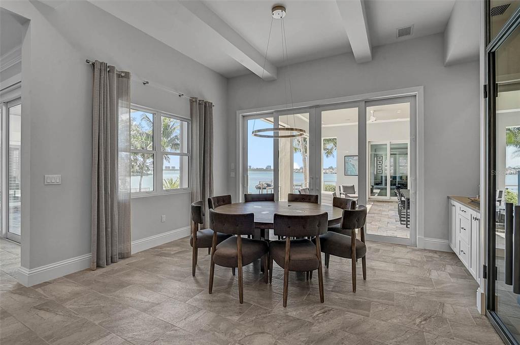 101 Seagull Lane Sarasota, FL 34236 - Photo 20 of 90 a view of a dining room with furniture and window