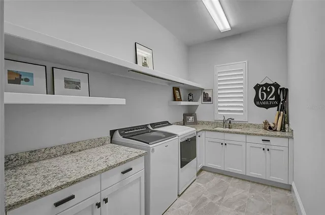 an aerial view of a house with a garden and trees